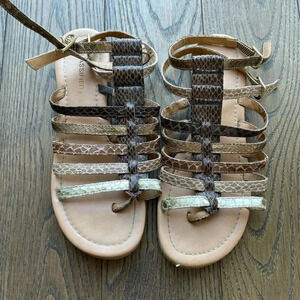 Size 6 women’s gold  metallic gladiator sandals.